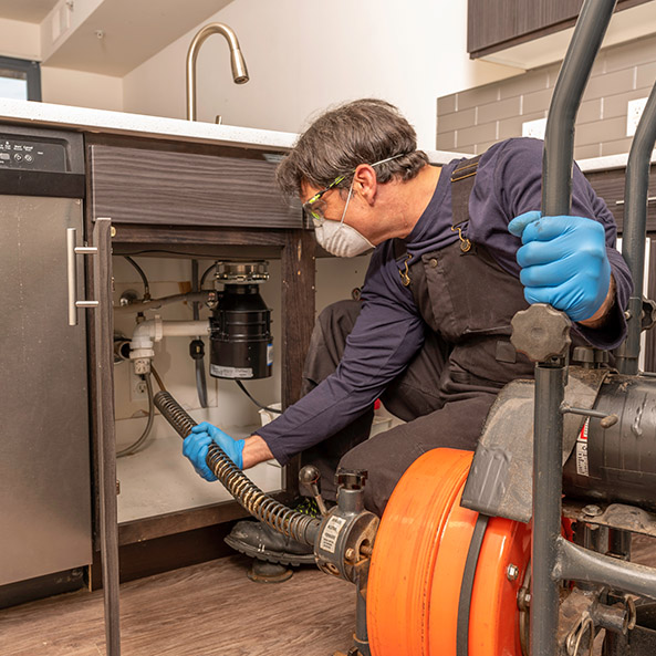 Plumber under sink